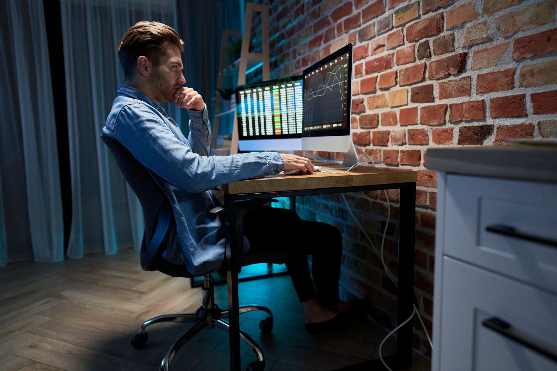 Business consultant working with analytics dashboards in an office